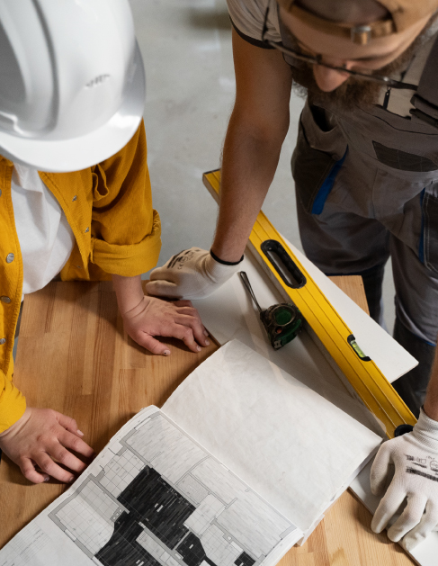 workers reviewing remodeling plans